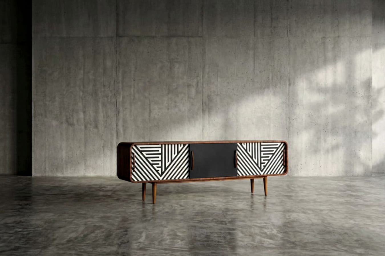 Sideboard z czarno-białym wzorem geometrycznym na wysokich nogach
